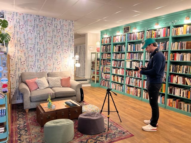 Content developer Lewis setting up a camera and tripod for an interview.